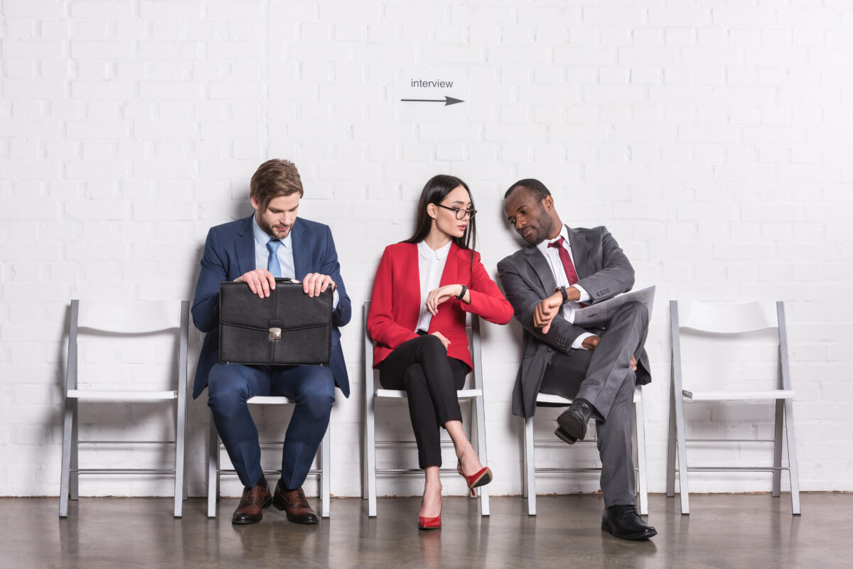 Small group of engineering candidates waiting to be interviewed