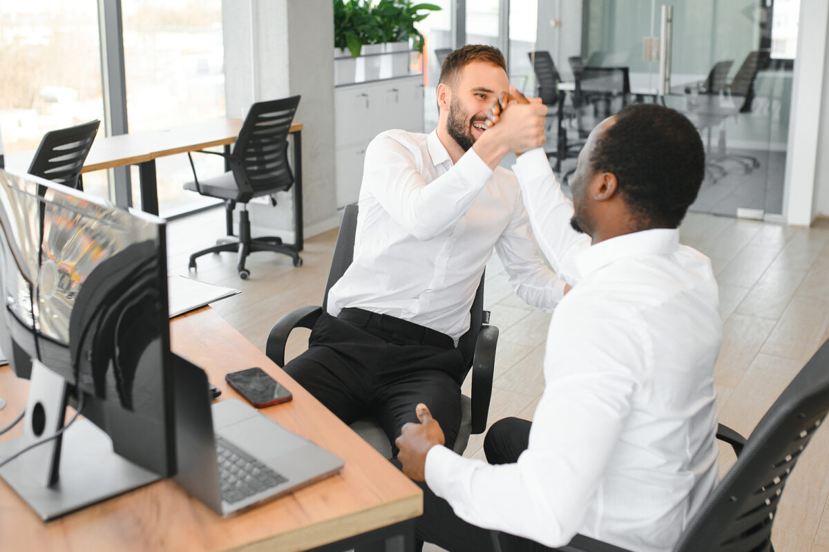 Two engineers achieve conflict resolution of design disagreement.